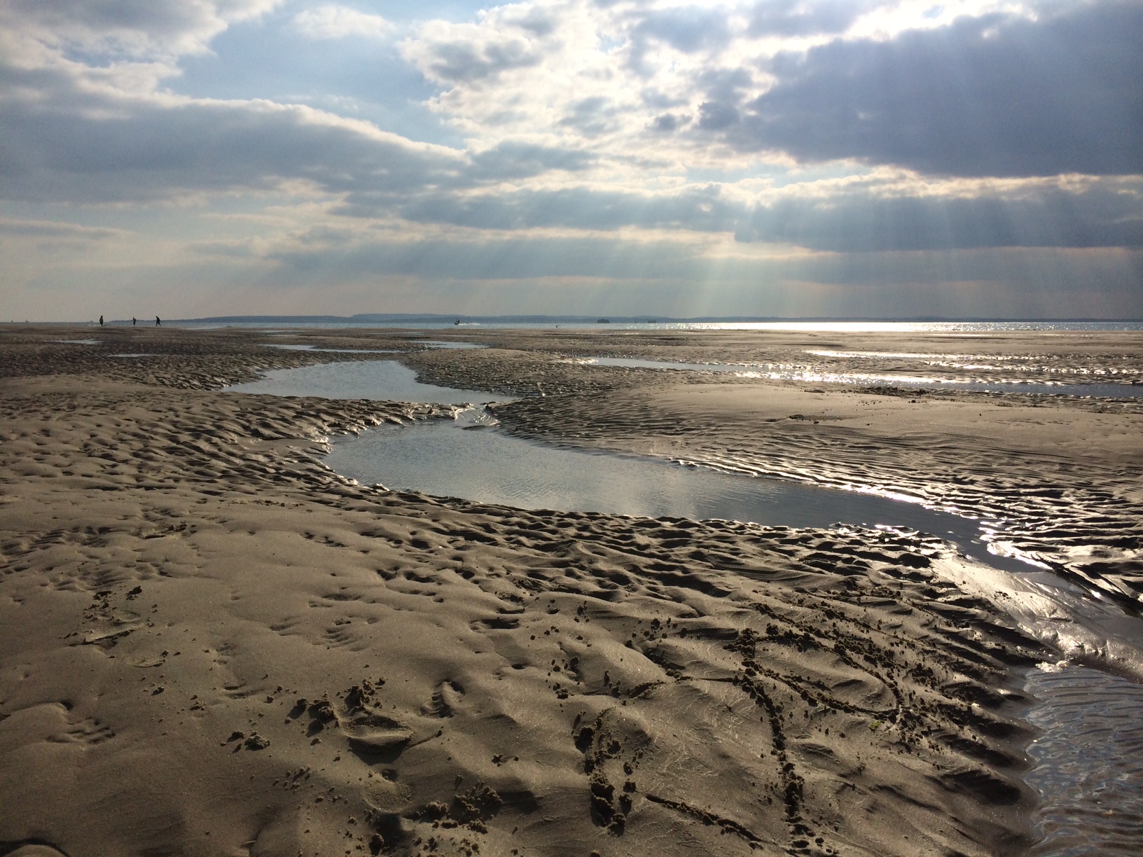 The East Winner sand bar, Hayling Island, in late summer sun showing fine crepuscular rays.