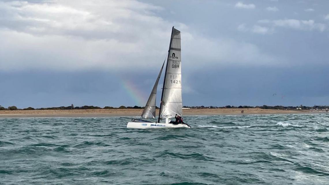 Nacra Infusion with rainbow behind